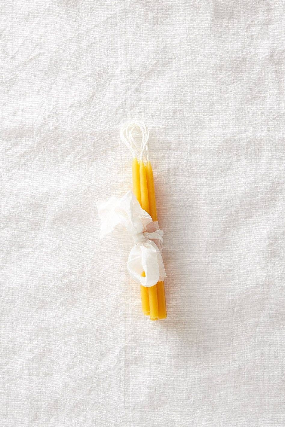 waxing moon Beeswax Birthday Candles, pack of 10 tied in cloth